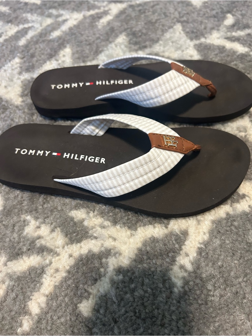 Tommy Hilfiger flip flops, size 7.  Excellent condition